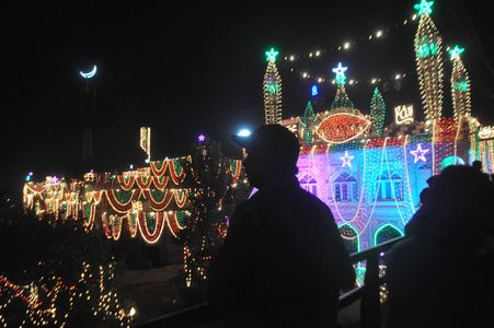 Muslim offer evening prayers in an illuminated mosque in Rawalpindi, Pakistan on September 27, 2023, ahead of celebrations on the occasion of the birth anniversary of Islam's Holy Prophet Muhammad.