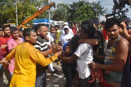 People have beaten a KMC worker after the accident. People were injured after a crane failure in brakes rammed civilians on the site. The incident occurred in Kolkata's Babu Ghat during the idol immersion.