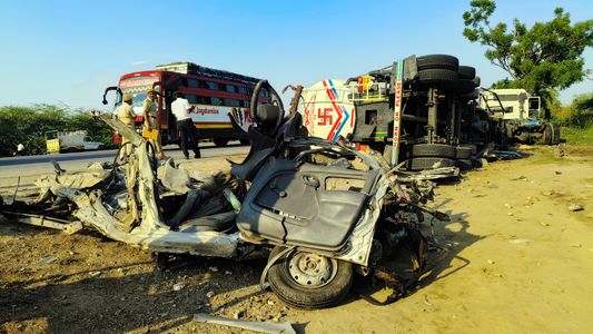 Police personnel and locals gather at the site after a speeding tanker overterned on the car, at Dudu in Jaipur district. Eight people of same family died in the accident. They were on their way to Ajmer, situated Dargah of Khwaja Garib Nawaz.
