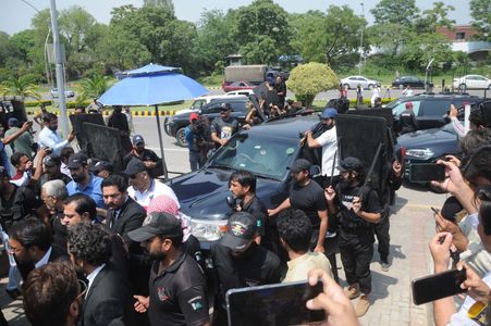 The Chairman of Pakistan Tehreek-e-Insaf (PTI) Imran Khan seen in a car as he arrives to appear before Islamabad High Court in cases registered against him. The Islamabad High Court (IHC) on Thursday granted Khan protective bail in cases for inciting violence including for the murder of senior Supreme Court lawyer Abdul Razzaq Shar, who was shot dead in Quetta earlier this week.