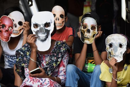 Children wearing skeleton masks take part in an awareness rally against the use of tobacco on "World no Tobacco Day" in Kolkata.