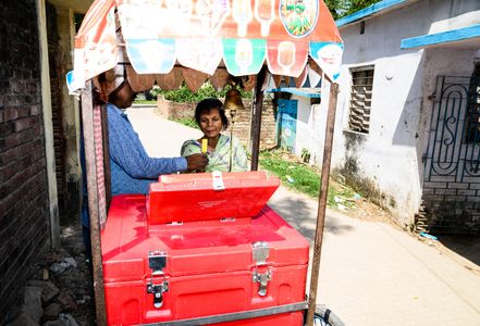 The summer season this year is expected to break records in India. February was the hottest since weather records started to be maintained in 1901, according to the India Meteorological Department (IMD). IMD said a significantly higher number of heatwave days from April to June are predicted over parts of Bihar, Jharkhand, Uttar Pradesh, Odisha, West Bengal, Chhattisgarh, Maharashtra, Gujarat, Punjab, and Haryana. The IMD warned that there would be a gradual rise of two-four degrees Celsius over the next five days in the country. Students and their parents buy and eat ice cream from a makeshift ice cream shop standing in the shade on the side of the road on their way home from rural Primary school on a hot afternoon at Tehatta.