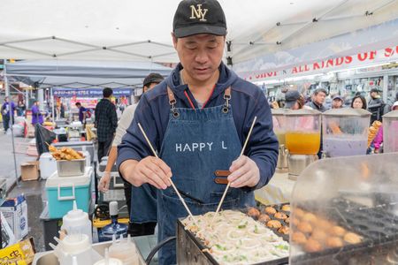 People celebrate Mid-Autumn Festival known as Moon Festival in Chinatown in Manhattan borough of New York with food and performances