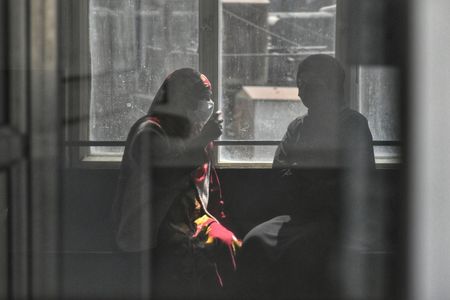 Covid-19 patient family members wait outside covid-19 ward of at JLNM hospital in downtown Srinagar the Summer captial of Indian Administrated Kashmir on April 10, 2023.