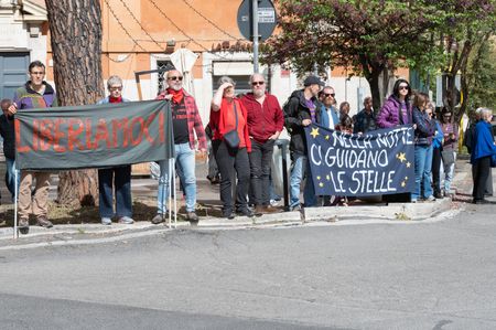 Thousands of people, associations and even representatives of political parties participated on 25/4/2023 in the demonstration called by the National Association of Partisans of Italy (ANPI) to commemorate the Liberation from the Nazi-fascists and the many who died for having participated in the Resistance. Arrival at Porta San Paolo, which together with other places in Rome was the scene of clashes between a part of the Roman population of every order and rank and the German troops who had occupied Rome. Many interventions, from the provincial president of the ANPI Fabrizio De Sanctis, to the Mayor of Rome Roberto Gualtieri and other personalities. In this picture some demonstrators holding up a banner