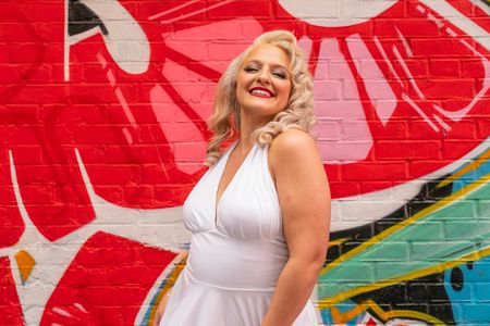 Deanna Giulietti poses after performing Torch Song Series debut on balcony of RiseNY museum in New York. This performance is first in monthly installments for the museum. She was joined by another singer - Sarah Cline.