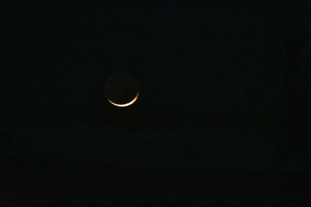 Moon seen in the sky on the eve of Eid-al-Fitr, , in Srinagar, the Summer captial of Indian Administrated Kashmir. Eid-ul-Fitr, which marks the end of the fasting month of Ramzan, will be celebrated across the country on Saturday.