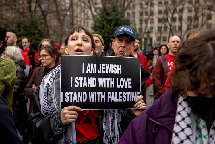 Jewish activists hold a Passover Seder outside ICE Headquarters in New York