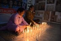 Lighting candles on the occasion of Thanksgiving Day