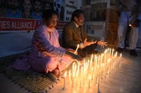 Lighting candles on the occasion of Thanksgiving Day