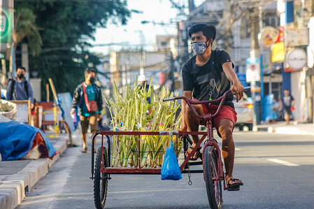 Vendors beside Antipolo Cathedral are selling woven palm leaves (locally known as palaspas) in Antipolo City today, March 27, 2021, one day before the celebration of Palm Sunday in Philippines.