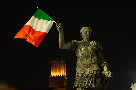Italian supporters celebrate the victory of the Italian national football team in via dei Fori Imperiali in Rome