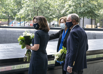 Governor Kathy Hochul pays respects at 9/11 Memorial & Museum with Chairman and former Mayor Michael Bloomberg. They were accompany by Museum President & CEO Alice Greenwald. They laid flowers in memory of those who died on September 11, 2001 during terrorist attack on World Trade Center.