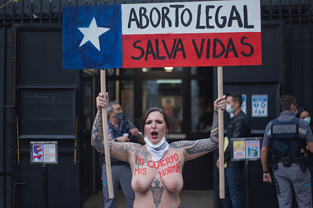(EDITORS NOTE: Image contains nudity) A Femen activist protests for the right to abortion in Texas at the doors of the American embassy in Madrid.