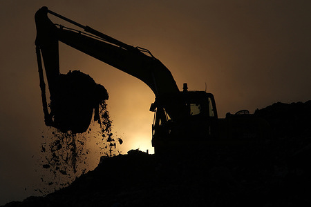 Silhouettes of an excavator and a scavenger collect garbage at the Bantargebang Integrated Waste Disposal Site, Bekasi City, West Java, Indonesia. Currently, the height of the landfill at the Bantargebang Integrated Waste Disposal Site has reached the maximum limit. The height reaches 50 meters in an area of 104 hectares and the amount of waste per day reaches 7400 tons.
Bantargebang Integrated Waste Disposal Sites Area, Bekasi City, West Java, Indonesia. Currently, the height of the landfill at the Bantargebang Integrated Waste Disposal Site has reached the maximum limit. The height reaches 50 meters in an area of 104 hectares and the amount of waste per day reaches 7400 tons.
