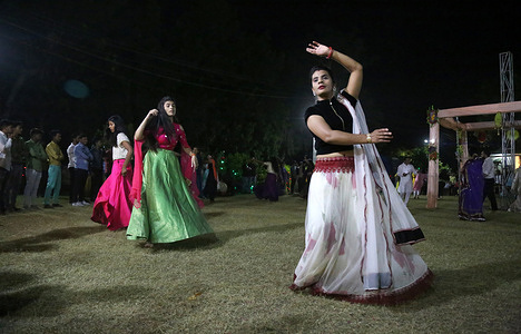 Indian women perform Garba, a traditional folk dance during Navratri Durga Puja festival in Beawar.