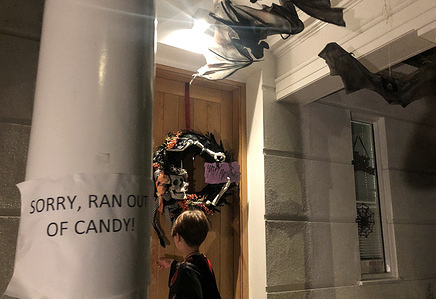Children going from house to house for traditional trick or treating in St. John's Wood neighbourhood in London.