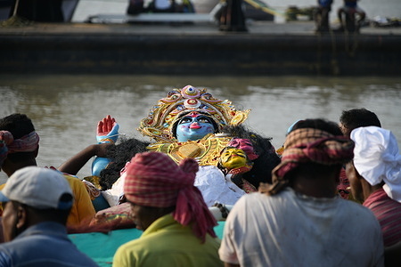 Kali idol immersion on the 3rd day in the Ganges amid 2nd year of Covid-19 pandemic. The worship of Goddess Kali in autumn is single day annual Hindu worship. It was celebrated on the 4th November, 2021 (new moon day or Dipannita Amavasya) of the Hindu calendar month Kartik.