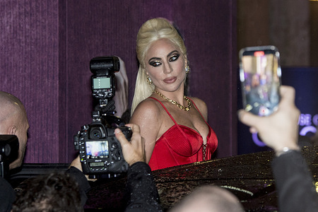 Lady Gaga greets fans at the House of Gucci premiere in Milan.