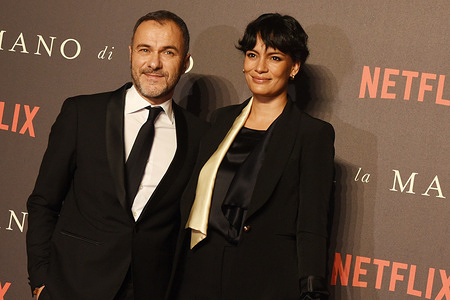 The Actor Massimiliano Gallo on (L) side and his mate Shalana Santana, on (R) side, on the red carpet during the presentation of his last film " E' stata la mano di Dio". The last work of director Paolo Sorrentino, presented at Metropolitan Cinema of Naples, was candidate for 2022 Oscar Prize as the best foreign film.