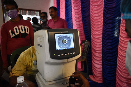 A man has a vision test inside a free eye-care camp in Kolkata.