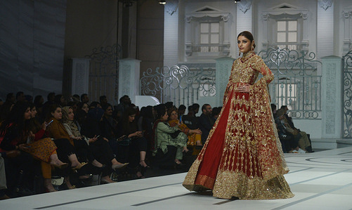 Pakistani model presents a creation by a brand Rici Melion East, Haris Shakeel, Saira Rizwan ,Faraz Abid Sheikh during Pantene Hum Bridal Couture Week at local hotel in Lahore. Twenty-eight designers and retail brands showcasing their latest bridal collections in the three-day event.