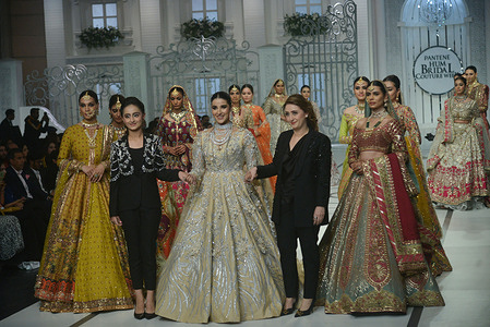Pakistani model presents a creation by a brand Fatima Salamat, Arooj Aziz, Rizwan Ahmed, Umsha by Uzma Babar, Edge Republic, Mina Kashif, Humayun Alamgir during Pantene Hum Bridal Couture Week at local hotel in Lahore. Twenty-eight designers and retail brands showcasing their latest bridal collections in the three-day event.