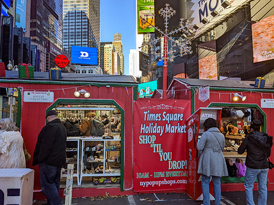 Holiday market stalls are being built at Times Square in New York City during the holiday season