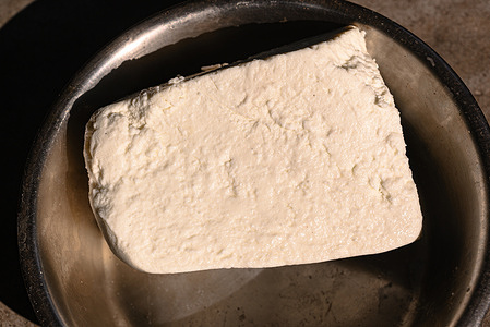 'Paneer', also known as 'ponir' or Indian cottage cheese, is a fresh acid-set cheese common in the Indian subcontinent (Bangladesh, Bhutan, India, Maldives, Nepal, Pakistan and Sri Lanka) made from cow or buffalo milk at Tehatta.