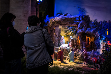 People watch Nativity Scene in Piazza del Campidoglio in Rome