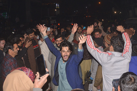 Pakistani youngsters celebrate New Year's eve on mall road in Lahore.