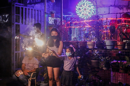 Filipinos celebrates New Year in Antipolo City. Despite of COVID-19 peak cases with Omicron variant threat, Filipinos are still continuing to welcome the year 2022. As of December 31, 2021, the Philippines logged a massive 2,961 new cases of COVID-19 that brings back the National Capital Region on Alert Level 3 this coming January 3 to January 15, 2022.