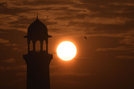 Stunning view of first sunrise of the year near historical Badshahi Mosque during morning time in Lahore.