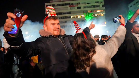 Crowded people celebrated New Year's Eve with the music and laser show entertainment by Izmir Municipality and have welcomed 2022 in Cumhuriyet Square in Izmir.
