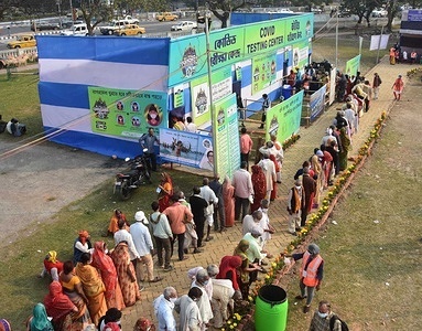 Pilgrims and sadhus are in queue to get their Covid-19 test before entering the Gangasagar transit camp in Kolkata.