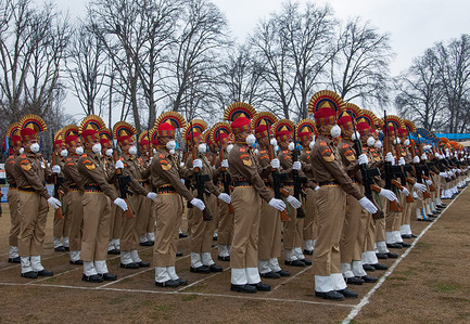 Indian Soldiers take part in a rehearsal for the upcoming Republic Day parade at a Cricket stadium in Srinagar.