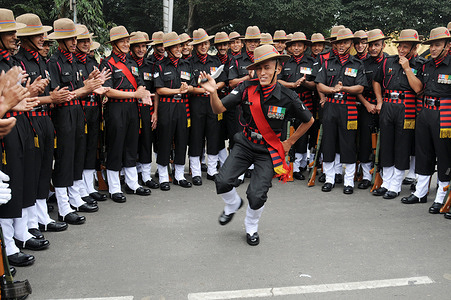 Indian soldiers dance before participating in the full dress rehearsal for the Republic Day parade in Kolkata.