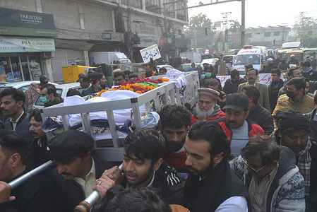 LAHORE-PUNJAB-PAKISTAN-JANUARY 25,2022= Pakistani people gathered to attend the funneral prayer of a killed local journalist Husnain Shah by Unidentified gunmen riding on a motorcycle shot outside the press club, in Lahore on January 25, 2022. Unidentified gunmen riding on a motorcycle shot and killed Husnain Shah in the city of Lahore on Monday before fleeing the scene, a police official and representatives of journalists said. (Photo by Rana Sajid Hussain / Pacific Press Agency)