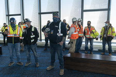 Workers who participated in construction attend Governor Kathy Hochul announcement of completion of Terminal B at LaGuardia Airport. LaGuardia becomes first airport in the world with dual pedestrian skybridges. Governor said that completion of new passenger facilities marks major milestone in Terminal B's $4 Billion transformation.