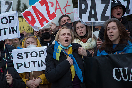 Dozens of Ukrainians protest in front of the Russian embassy against the Russian invasion of Ukraine.