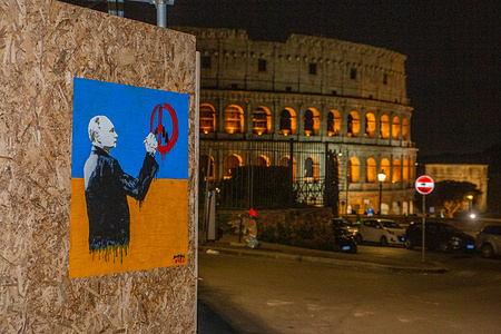 View of the mural against the war in Ukraine by street artist Harry Greb near Colosseum in Rome