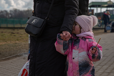 A Ukrainian girl cries after crossing the border from Medyka to Poland.
Thousands of Ukrainians arrive in Poland across the Medyka border fleeing the war. Since Russia's invasion of Ukraine began, more than 2 million people have fled for refuge, the vast majority of them women and children.