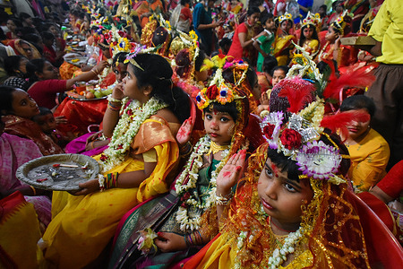 Girls dressed as a Kumari blesses devotees during rituals to celebrate the Hindu festival of Navratri inside the Adyapeath temple on the outskirts of Kolkata.