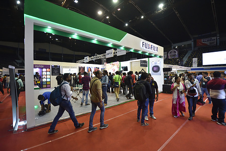 Visitors interact at the last day of a three days (16 to 18 April 2022) duration photography & videography trade show, where many renowned international and desi brands are present with their photographic equipment and accessories.