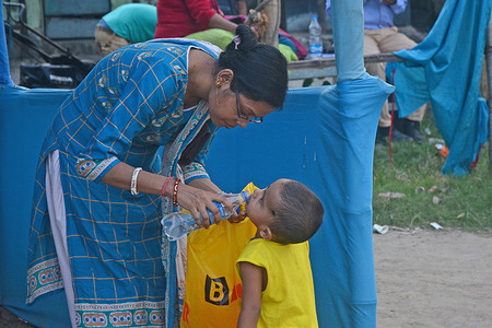 A mother was showing her love and affection to her baby on the happy mother's day. Mother's Day is a celebration honoring the mother of the family or individual, as well as motherhood, maternal bonds, and the influence of mothers in society. It is celebrated on different days in many parts of the world, most commonly in the months of March or May.