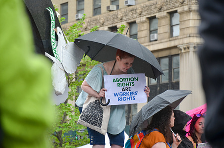 A woman is holding a sign at Foley Square in New York City to demand reproductive rights for all women, on May 14, 2022.