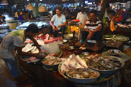 Fish vendors wait for customers at a market in Kolkata.