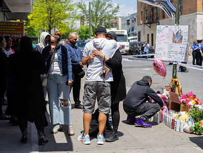 Family, friends and neighbors came to pay their respects at a makeshift memorial for the 11 year old Kyhrara Tay who died when she was struck by a stray bullet in the Bronx.