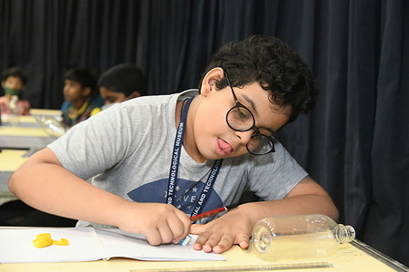 A school student is engaged here at the physics interactive activities during the five days duration Summer Camp at the Birla Industrial & Technological Museum (BITM).