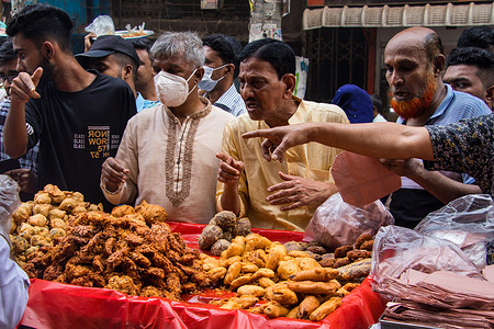 The biggest delicious traditional street foods market in the world is Chawkbazar. Cahawkbazar owners association arranges this traditional street foods market for one specific Arabic Holy month. This Holy month's name is Ramadan. They are arranging this traditional Street Foods Market for almost 400 years. All these pictures have been captured on April 3, 2022, from Old Town Dhaka.